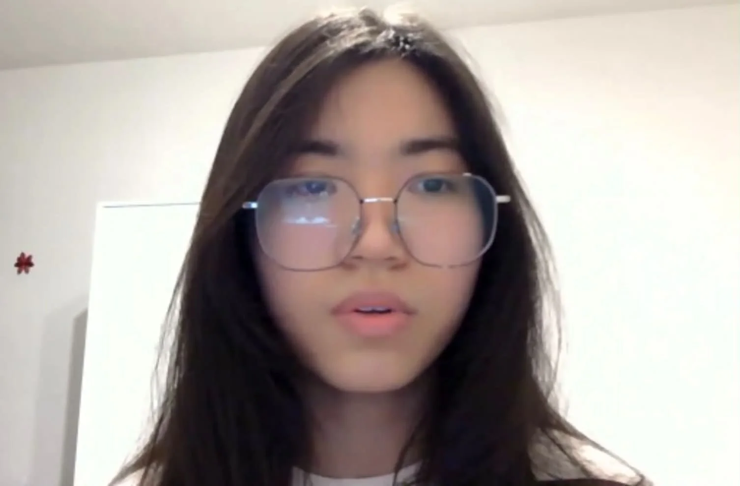 Young woman wearing glasses during a video call